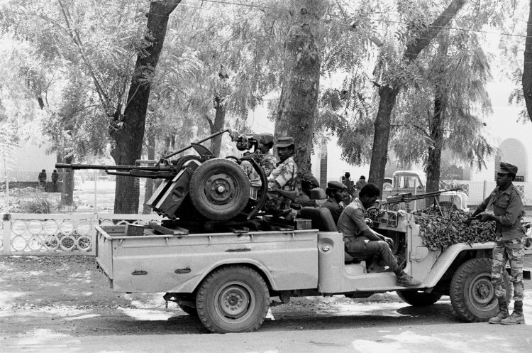 chadian soldiers in truck tight shot passenger looking to camera
