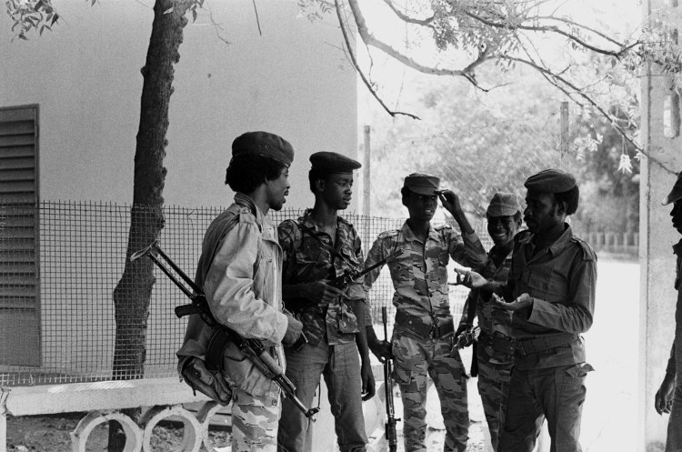 five chadian soldiers talking under tree ndjamena 1982