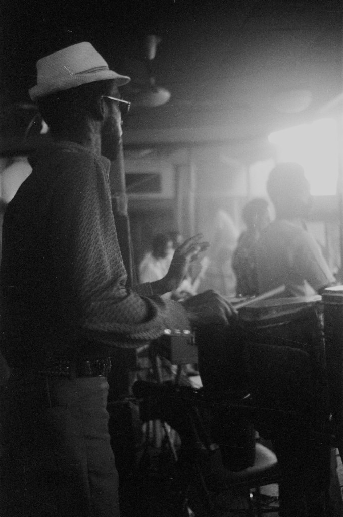 drummer on stage wearing a hat and sunglasses in lagos