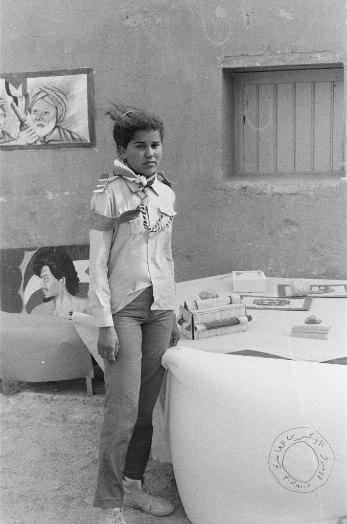 girl in jeans with exhibits stands in the wind polisario ten year celebration western sahara 1986