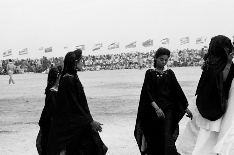 girls dancing in black robes polisario ten year celebration western sahara 1986