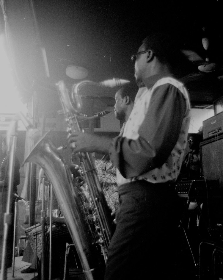 saxophone players at the shrine lagos pausing and watching