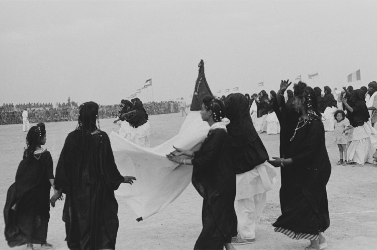 women in black robes dancing at polisario ten year anniversary western sahara 1986